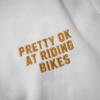 Pretty Ok At Riding Bikes (Orange Embroidery Ltd Edition)